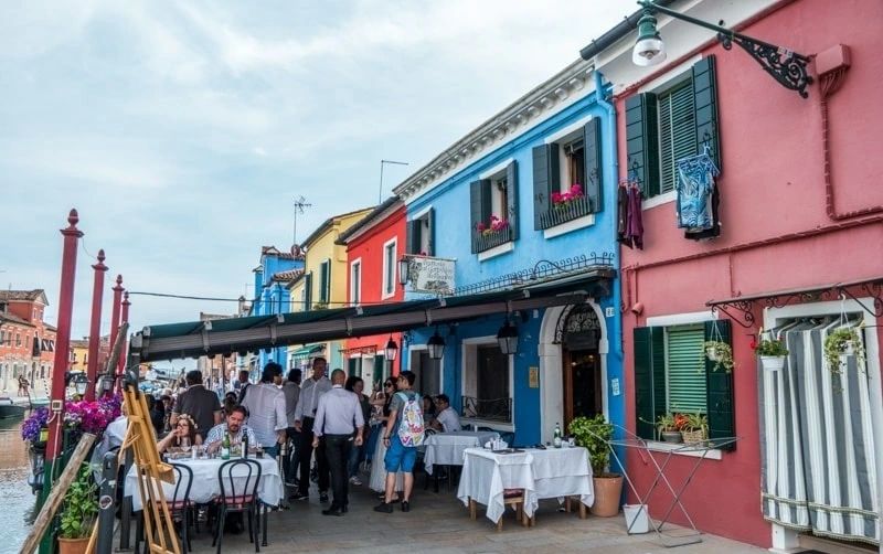 Fresh seafood and canal views at Al Gatto Nero at Burano Island's best seafood restaurant. Fresh seafood and canal views at Al Gatto Nero at Burano Island's best seafood restaurant.