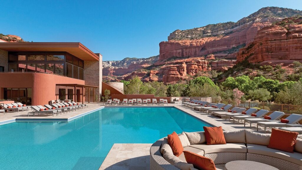 Resort pool with red rock views.