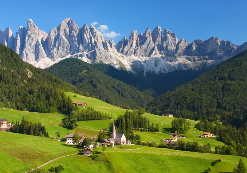Dolomites-Italian-Alps Alpine village nestled in mountains.